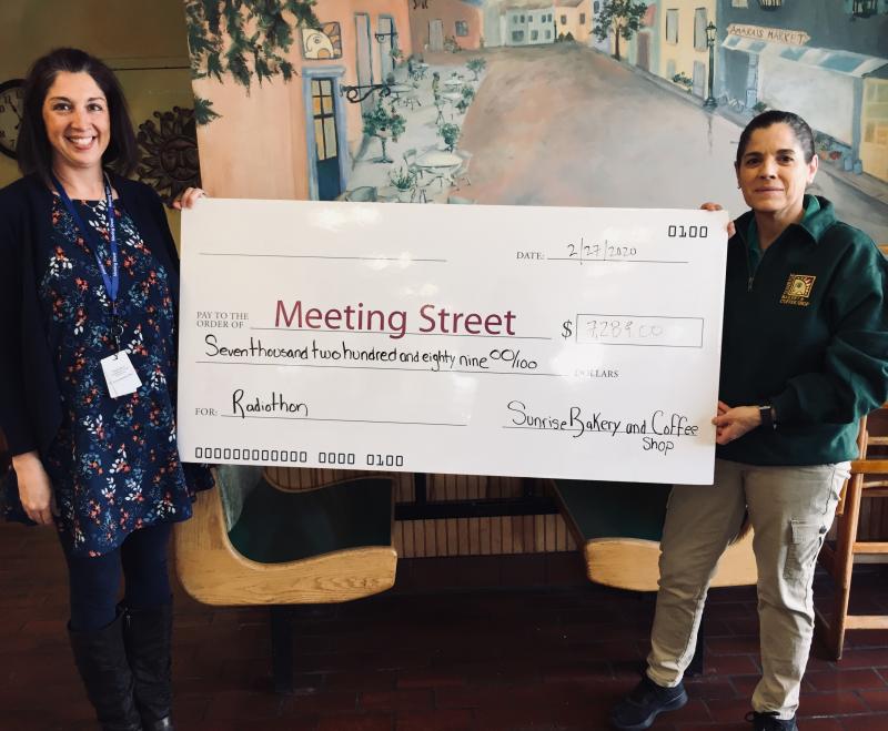 Dartmouth, MA news - The Schwartz School at Meeting Street Assistant Director of Special Education Katelyn Champine accepts a check for $7,289 from Louise Amaral of Sunrise Bakery. Photo courtesy: Meeting Street